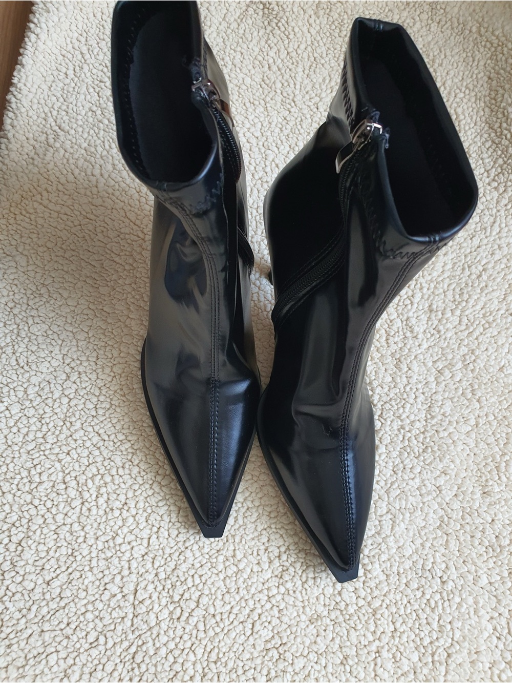 Super sleek,elegant,and sophisticated black patent ankle boots